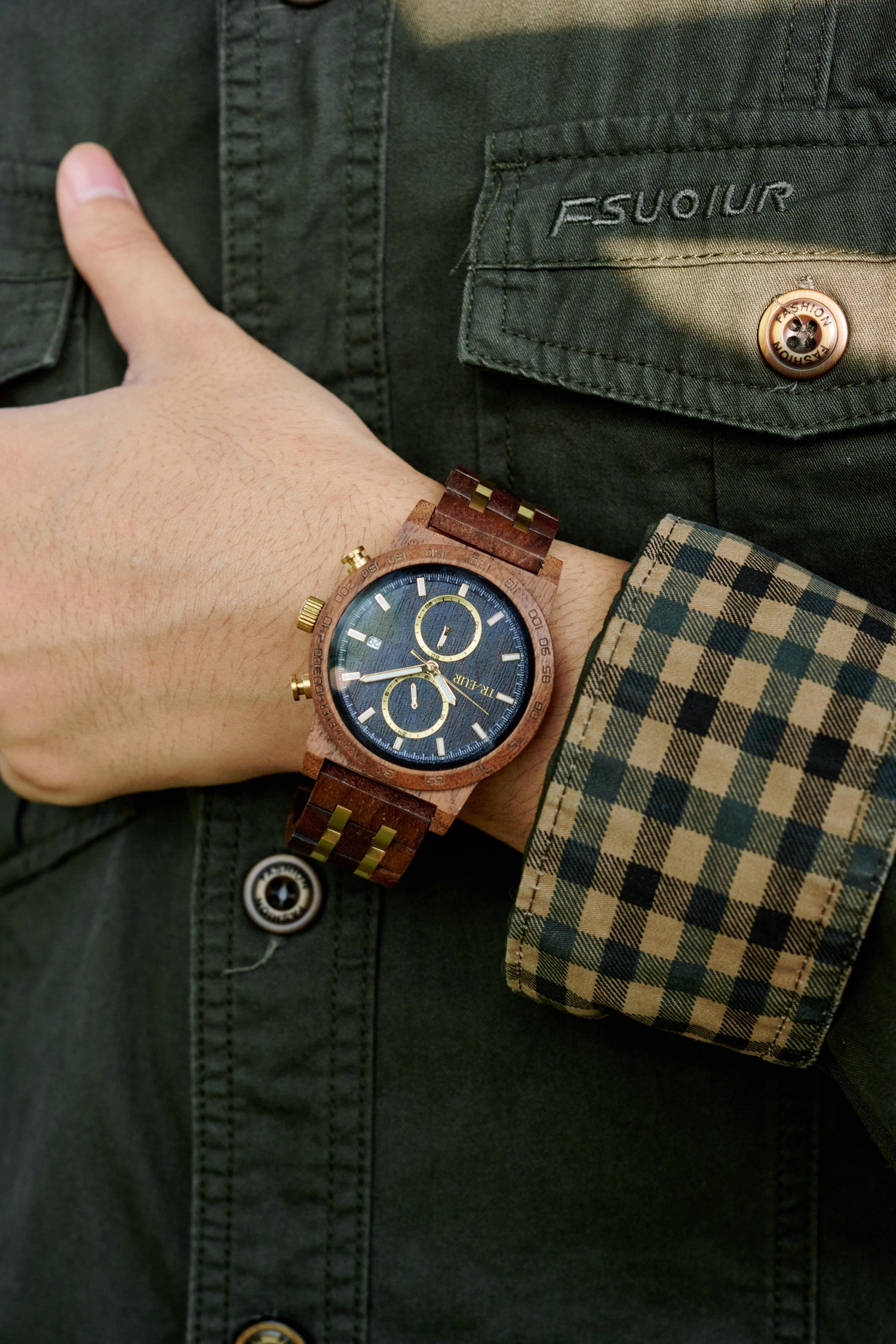 Three stylish BOBO BIRD wooden wristwatches with blue and black dials on a textured black surface