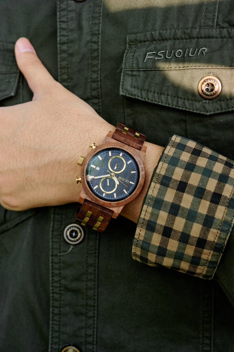 Three stylish BOBO BIRD wooden wristwatches with blue and black dials on a textured black surface