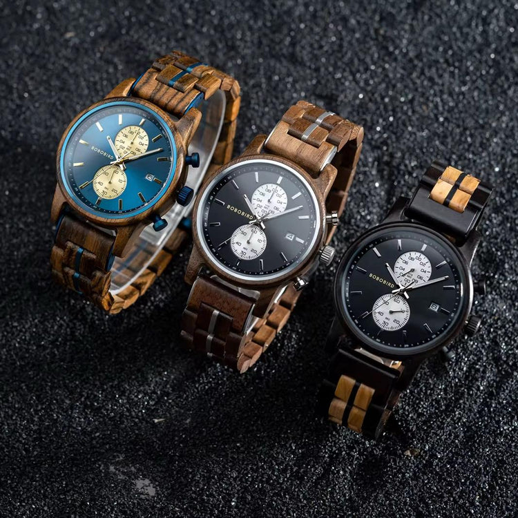 Three BOBO BIRD wooden wristwatches with chronograph dials on black textured surface
