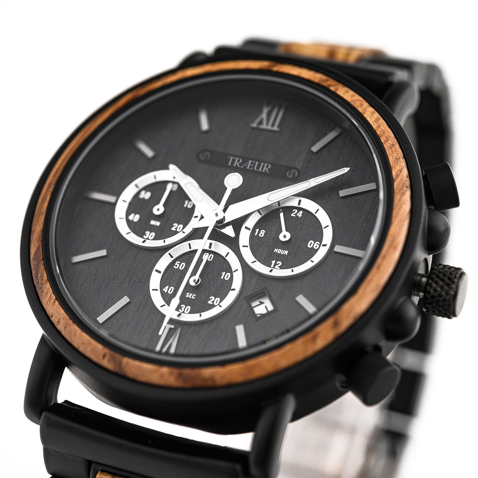 Close-up of TRÆUR black chronograph watch with wooden bezel and date display